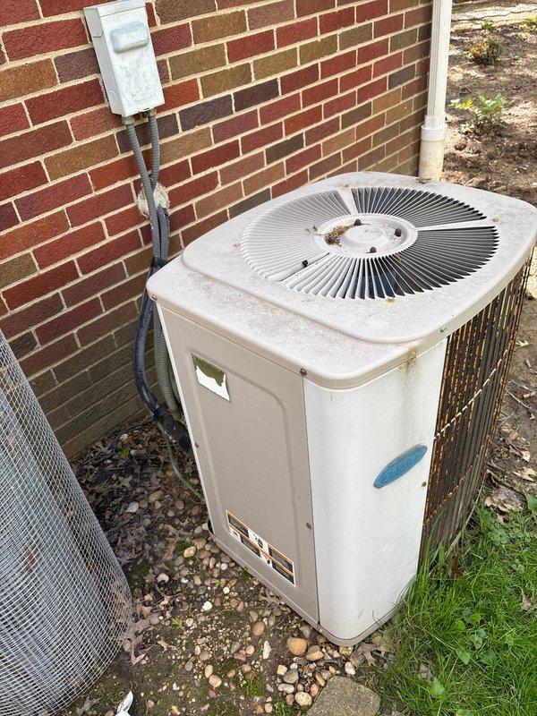 Completed spring maintenance on residential cooling system. Performed comprehensive inspection of outdoor condenser unit and indoor furnace components, documenting equipment condition with photos. Condenser unit showed signs of weathering with rust staining and discoloration on exterior panels, but remains operational. Verified electrical connections and disconnect box functionality. Indoor Carrier furnace inspected with all manufacturer specifications and control interfaces checked for proper operation. System ready for cooling season.