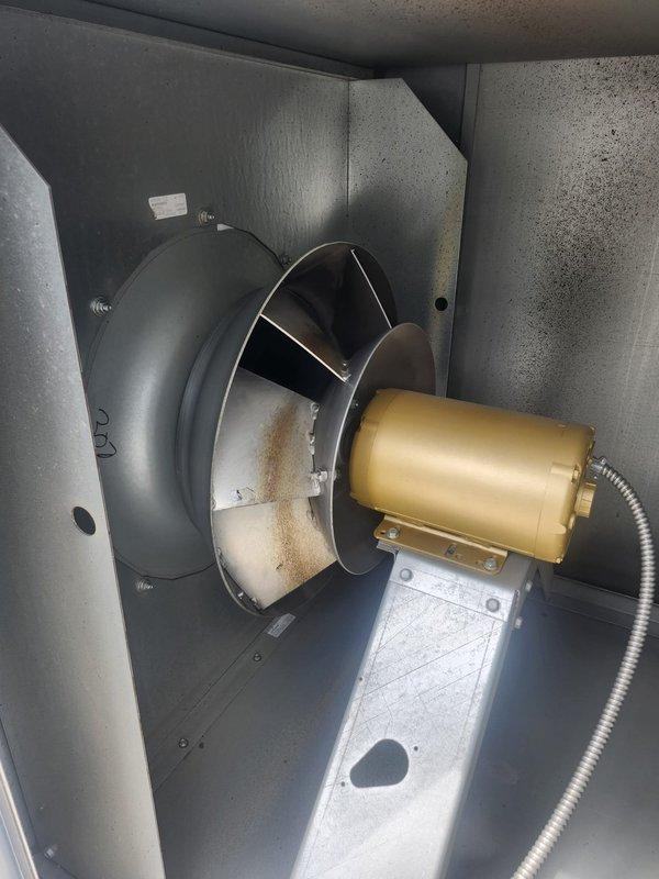 Performed routine maintenance inspection on makeup air unit per customer request. Verified operation of blower motor, fan assembly, and heat exchanger components. Documented equipment condition with photos showing interior cabinet components, motor mounting, and heat exchanger tube assembly in satisfactory operating condition.