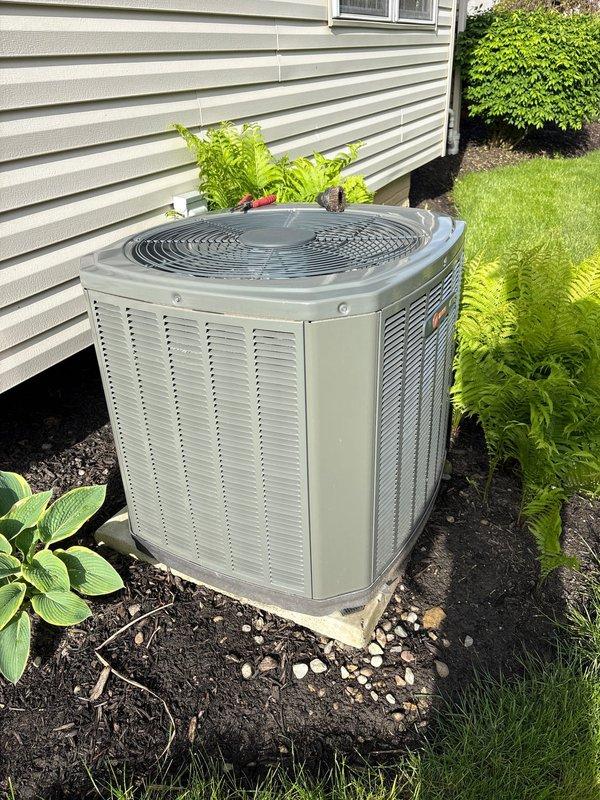 Completed comprehensive spring maintenance on residential outdoor air conditioning condenser unit. Performed thorough system inspection, cleaned condenser coils, verified proper refrigerant levels, tested electrical components, and confirmed optimal airflow through the unit's top-mounted fan assembly. Unit operating efficiently with all components functioning within normal parameters.