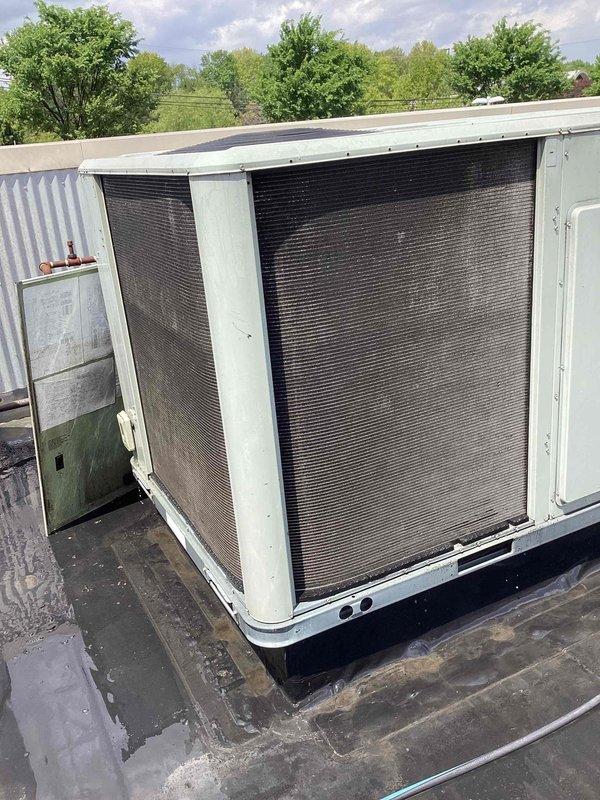 Completed spring maintenance on rooftop-mounted Trane commercial HVAC unit. Performed comprehensive inspection of copper coil assembly, electrical connections, and all mechanical components. Unit found in good operating condition with clean coils and properly functioning systems. Documented equipment condition with photos showing interior components and exterior unit placement.