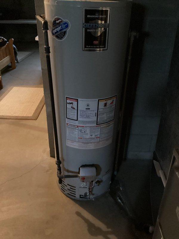Responded to service call for evaluation of failing 50-gallon tanked water heater with defective air tank and active leak. Conducted on-site inspection and documented existing unit condition, including all manufacturer specifications, plumbing connections, venting configuration, and installation setup in basement utility area. Assessed current water heating capacity requirements and discussed options for potential capacity upgrade with homeowner. Photographed existing equipment, piping connections, exhaust venting, and surrounding utility space to facilitate accurate replacement estimate preparation. Provided professional recommendations for new water heater installation based on household needs and existing infrastructure.