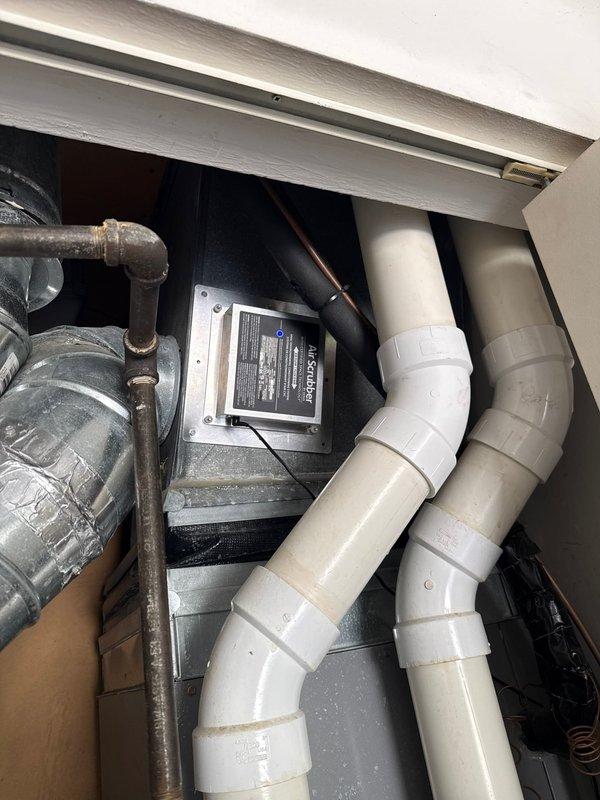Responded to service call for air quality equipment maintenance. Successfully replaced UV air scrubber bulb in the HVAC system to restore proper air purification functionality. Inspected outdoor condenser unit and verified proper operation of all cooling system components.