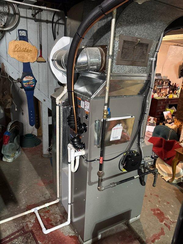 Completed A/C add-on installation to existing furnace system with electrical infrastructure previously in place. Performed pressure leak test using Yellow Jacket digital testing device, which confirmed system integrity with 0.5% pressure drop over five-minute test period, meeting acceptable parameters. Installed refrigerant lines with proper insulation, connected condensate drainage via PVC piping, and verified all mechanical connections to furnace unit and ductwork system.