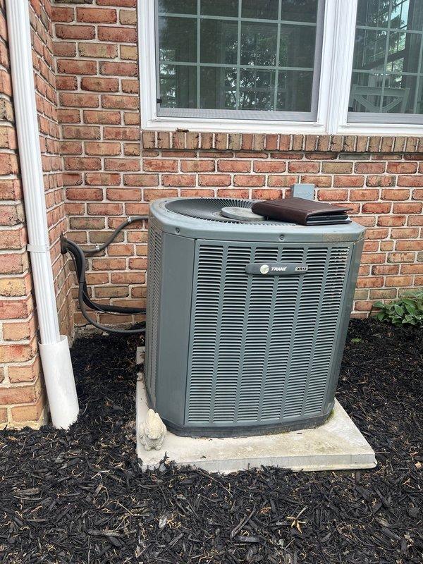 Completed full HVAC system replacement including outdoor condensing unit and indoor furnace. Installed new Trane air conditioning condenser on existing concrete pad with proper refrigerant line connections through exterior brick wall. Replaced indoor furnace unit in basement mechanical room with new equipment, ensuring proper integration with existing ductwork and utility connections. All components installed to manufacturer specifications and tested for proper operation.