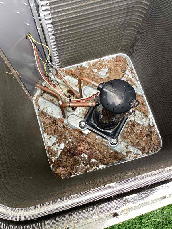 Completed spring maintenance on commercial HVAC unit. Performed standard preventive maintenance inspection of outdoor condensing unit and indoor air handler components. Inspected compressor, refrigerant lines, and electrical connections on outdoor unit, noting significant rust and corrosion present throughout base pan requiring monitoring for future replacement consideration. Evaluated indoor air handler evaporator coil section and condensate management system. Confirmed condensate pump operational with proper drainage through copper discharge lines. Inspected drain pan for standing water and verified adequate slope for drainage. Observed mineral deposits and water staining in drain pan consistent with normal operation. Checked all electrical connections and wiring for secure terminations. System operational and cooling properly at time of service completion.