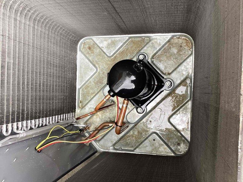 Completed spring maintenance on commercial HVAC unit. Performed standard preventive maintenance inspection of outdoor condensing unit and indoor air handler components. Inspected compressor, refrigerant lines, and electrical connections on outdoor unit, noting significant rust and corrosion present throughout base pan requiring monitoring for future replacement consideration. Evaluated indoor air handler evaporator coil section and condensate management system. Confirmed condensate pump operational with proper drainage through copper discharge lines. Inspected drain pan for standing water and verified adequate slope for drainage. Observed mineral deposits and water staining in drain pan consistent with normal operation. Checked all electrical connections and wiring for secure terminations. System operational and cooling properly at time of service completion.