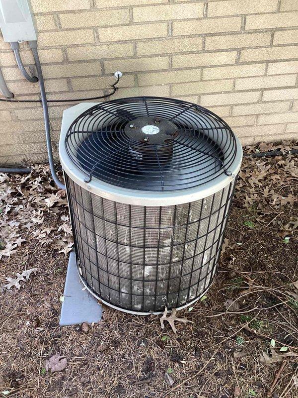 Completed scheduled spring maintenance on commercial HVAC system. Performed comprehensive inspection of outdoor condenser unit, noting normal weathering and dirt accumulation on exterior surfaces and protective grille. Verified condenser positioning on concrete pad remains stable with proper clearance from building structure. Inspected electrical conduit and refrigerant line connections along exterior wall mounting for secure attachment and absence of damage.

Accessed indoor HVAC components through metal ductwork panel. Confirmed Koch brand equipment installation with system documentation visible and legible. Conducted standard preventive maintenance procedures including visual inspection of ductwork connections and system accessibility points. All major components operating within normal parameters with no immediate service needs identified at time of visit.