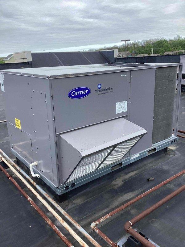 Responded to commercial facility reporting severe humidity issues with water accumulation requiring manual mopping. Inspected Carrier WeatherMaker rooftop unit and evaluated air filtration system. Found filters dated 3-23-26 showing signs of use and debris accumulation. Documented equipment condition including refrigerant lines, electrical components, and overall system operation to address excessive moisture concerns.