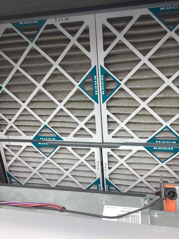 Responded to commercial facility reporting severe humidity issues with water accumulation requiring manual mopping. Inspected Carrier WeatherMaker rooftop unit and evaluated air filtration system. Found filters dated 3-23-26 showing signs of use and debris accumulation. Documented equipment condition including refrigerant lines, electrical components, and overall system operation to address excessive moisture concerns.