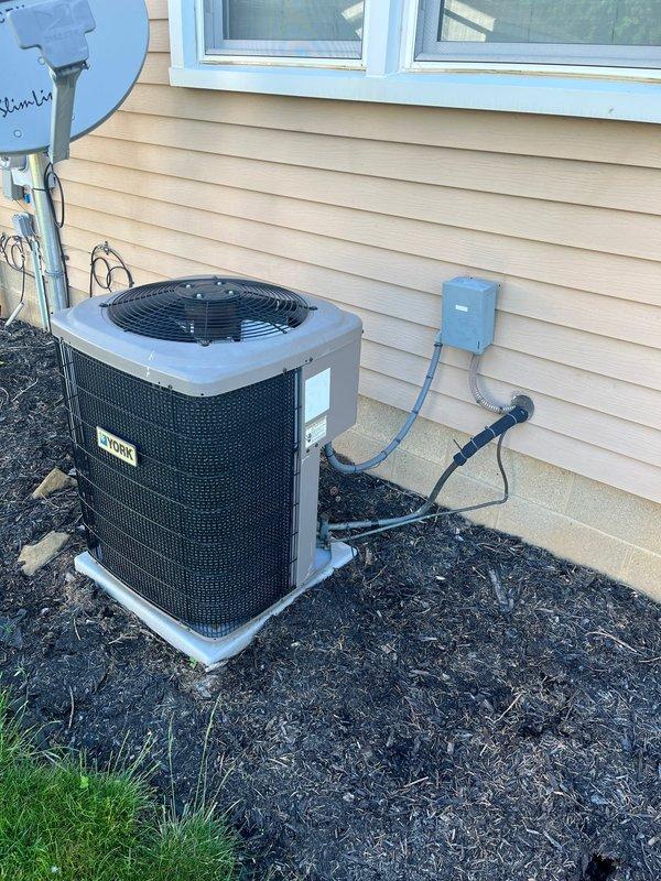 Conducted comprehensive assessment of existing HVAC system for replacement estimate. Evaluated indoor furnace unit and outdoor condensing unit, documenting current equipment configuration, ductwork connections, electrical service, and installation conditions. Photographed basement utility area showing green furnace with adjacent water heater and metal duct system, as well as exterior condensing unit with electrical disconnect and proper placement on concrete pad. Provided detailed replacement options and specifications based on current system layout and customer requirements.