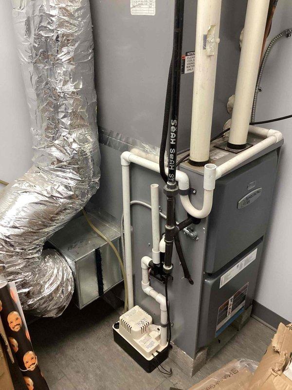 Completed scheduled commercial filter maintenance on Payne furnace system. Accessed furnace cabinet, inspected blower motor assembly and internal components, and replaced air filters in white metal air handler unit. Verified all mechanical components operating within normal parameters, checked condensate drain lines and PVC venting for proper function, and confirmed ductwork connections secure. System restored to full operation with improved airflow efficiency.