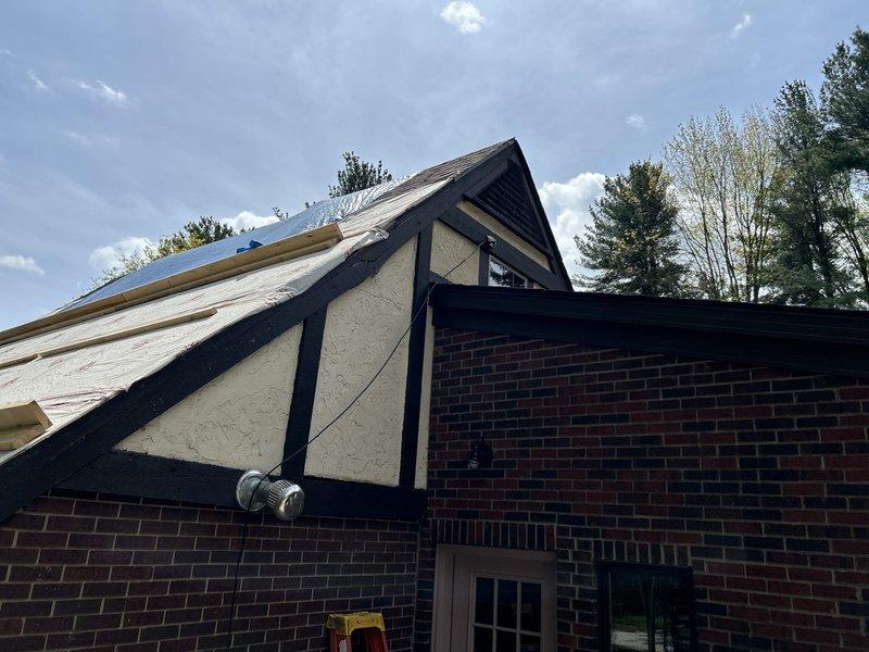 Removed damaged refrigerant lines and line cover assembly from exterior wall to provide access for soffit repair work on residential property. Temporarily relocated HVAC line sets to facilitate carpentry repairs on gable end structure, ensuring existing multi-unit system configuration remained protected during construction phase.
