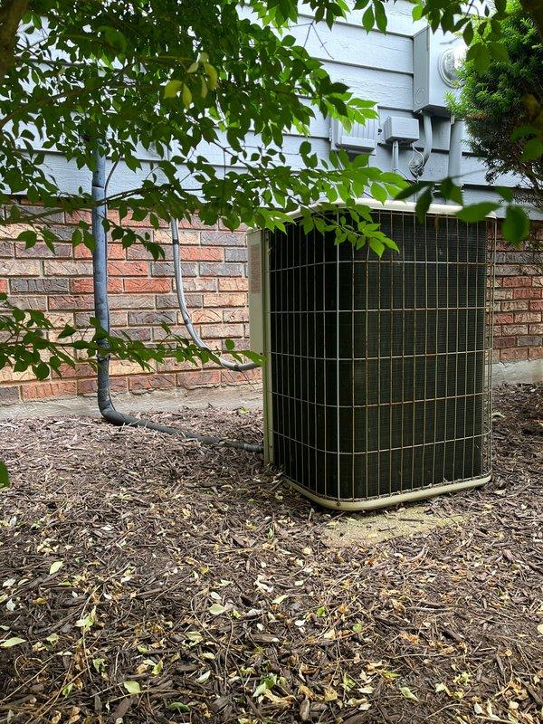 Conducted comprehensive assessment of existing HVAC system including outdoor air conditioning condenser unit and indoor gas furnace for replacement estimate. Evaluated current equipment condition, measured existing unit specifications, documented installation locations, and photographed both exterior condenser positioned on concrete pad near building perimeter and interior furnace system with ductwork configuration in basement utility area. Provided customer with replacement options and system sizing recommendations based on home requirements.