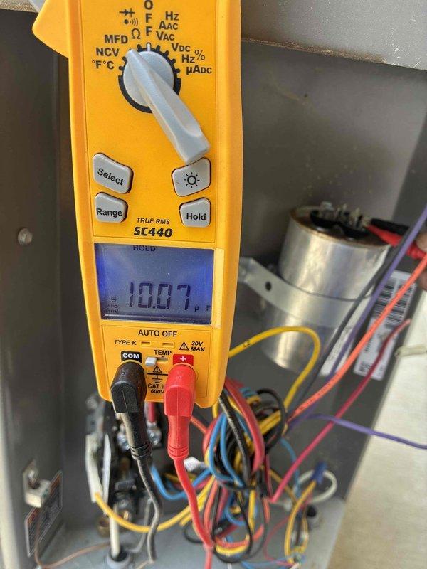 Completed spring maintenance on outdoor cooling system. Performed electrical diagnostics using multimeter, recording voltage readings at capacitor and verifying proper electrical parameters throughout the system. Inspected condenser unit exterior, coils, and fan assembly for operational condition and typical seasonal wear.
