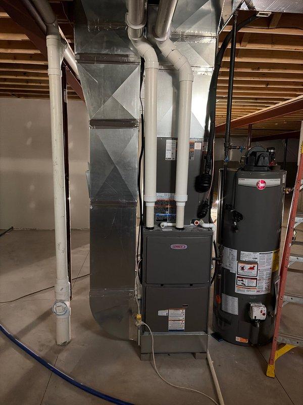 Completed new construction HVAC finish installation in residential basement, including Lennox furnace and water heater setup with full ductwork connections and PVC venting system. Performed system commissioning and vacuum testing of refrigerant lines to verify proper evacuation levels, ensuring all equipment met manufacturer specifications and operational standards. All mechanical systems tested and confirmed operational with proper airflow distribution throughout the space.