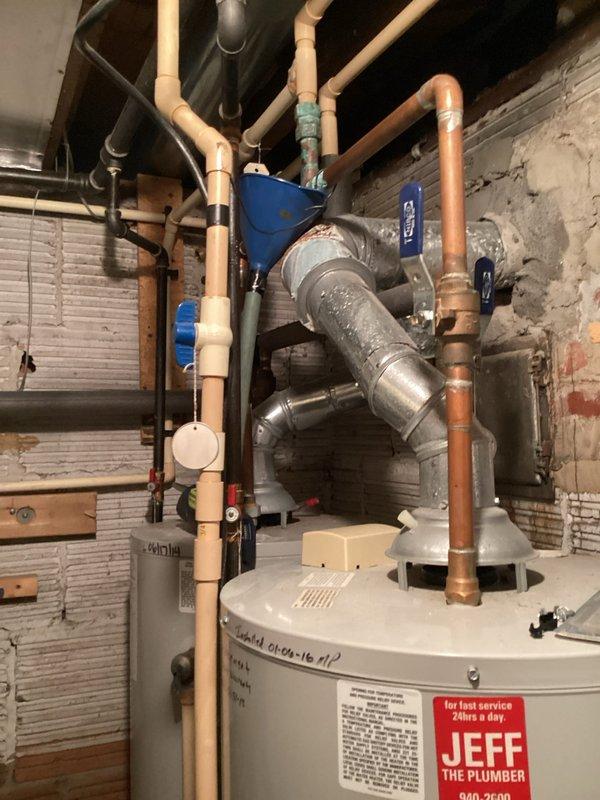 Responded to customer report of natural gas odor originating from furnace/AC utility room following recent AC maintenance. Performed thorough safety inspection of the mechanical room, including gas leak detection procedures and examination of all gas-fired equipment connections. Inspected furnace, water heater, and associated gas piping for potential leaks or compromised fittings. Documented existing plumbing and HVAC infrastructure conditions via photographs for service records. All gas connections tested and verified secure with no active leaks detected at time of inspection.