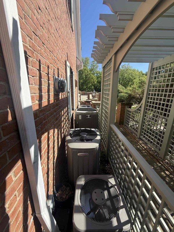 Completed annual cooling system maintenance on five residential HVAC units located in exterior side yard area. Performed comprehensive tune-up procedures on all condensing units, including inspection of fan assemblies, electrical connections, refrigerant levels, and overall system operation. All units, including multiple Lennox branded condensers, were serviced and found to be operating within normal parameters for continued cooling season performance.