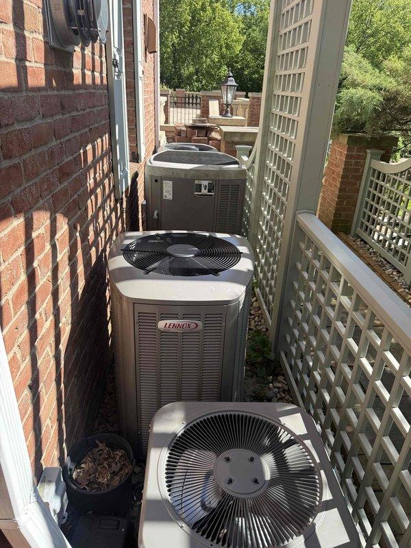 Completed annual cooling system maintenance on five residential HVAC units located in exterior side yard area. Performed comprehensive tune-up procedures on all condensing units, including inspection of fan assemblies, electrical connections, refrigerant levels, and overall system operation. All units, including multiple Lennox branded condensers, were serviced and found to be operating within normal parameters for continued cooling season performance.