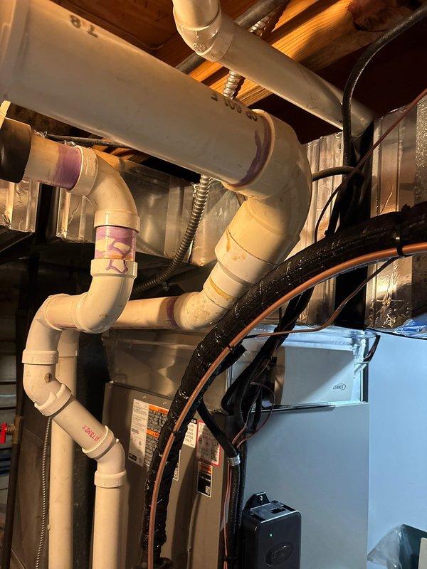 # HVAC Install - A/C & Coil

Completed full air conditioning system replacement including new condenser unit and evaporator coil installation. Removed existing equipment and installed new A/C system with proper refrigerant line connections, condensate drainage integration with existing PVC piping system, and electrical connections. Installed new evaporator coil in the air handler with proper ductwork connections to existing supply and return plenum. Verified all connections were secure, tested system operation, and confirmed proper airflow through the ductwork. System is fully operational and cooling efficiently.
