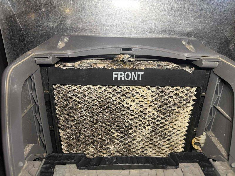 Completed maintenance agreement cooling service on two air conditioning systems, both over 10 years old. Performed comprehensive inspection and maintenance on both units, including filter evaluation. Documented heavily soiled air filters showing significant accumulation of dust, dirt, and debris with yellow-tan discoloration, indicating extended service period without replacement. Filters displayed restricted airflow capacity due to particulate buildup. Captured photographic documentation of filter conditions for maintenance records. Systems evaluated and serviced per maintenance agreement specifications.