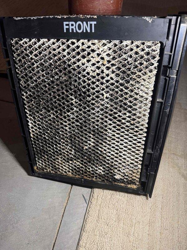 Completed maintenance agreement cooling service on two air conditioning systems, both over 10 years old. Performed comprehensive inspection and maintenance on both units, including filter evaluation. Documented heavily soiled air filters showing significant accumulation of dust, dirt, and debris with yellow-tan discoloration, indicating extended service period without replacement. Filters displayed restricted airflow capacity due to particulate buildup. Captured photographic documentation of filter conditions for maintenance records. Systems evaluated and serviced per maintenance agreement specifications.