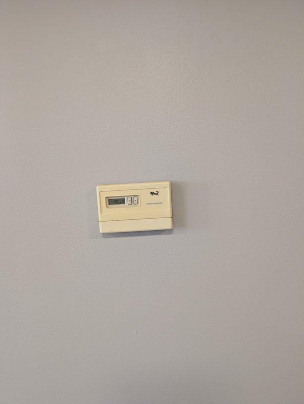Responded to service call for commercial air conditioning unit not activating. Found thermostat was set to Celsius temperature scale, preventing proper unit operation. Reconfigured thermostat settings to Fahrenheit and verified system activation and proper communication with HVAC equipment. Unit now cycling correctly and maintaining desired temperature setpoint.