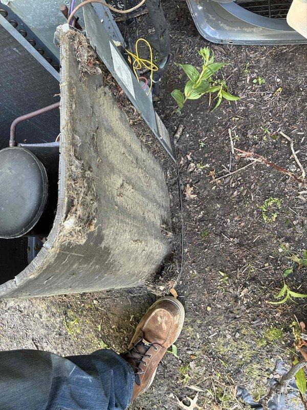 Completed routine cooling maintenance on a 5-year-old air conditioning system. Performed standard tune-up procedures including inspection of outdoor condensing unit, which showed significant exterior casing damage with exposed internal components and biological growth on housing. All maintenance tasks were completed as scheduled.