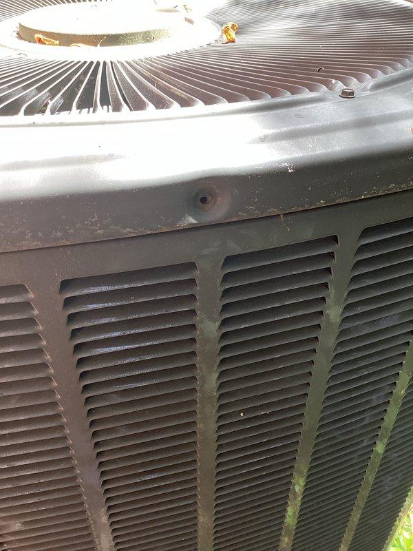 Responded to service callback for outdoor condensing unit with missing access panel. Upon arrival, found lower access panel had been inadvertently left off following recent preventive maintenance visit. Reinstalled and secured panel with appropriate fasteners to restore unit to proper operating condition. Unit exterior and refrigerant line penetrations confirmed intact with no additional service required.