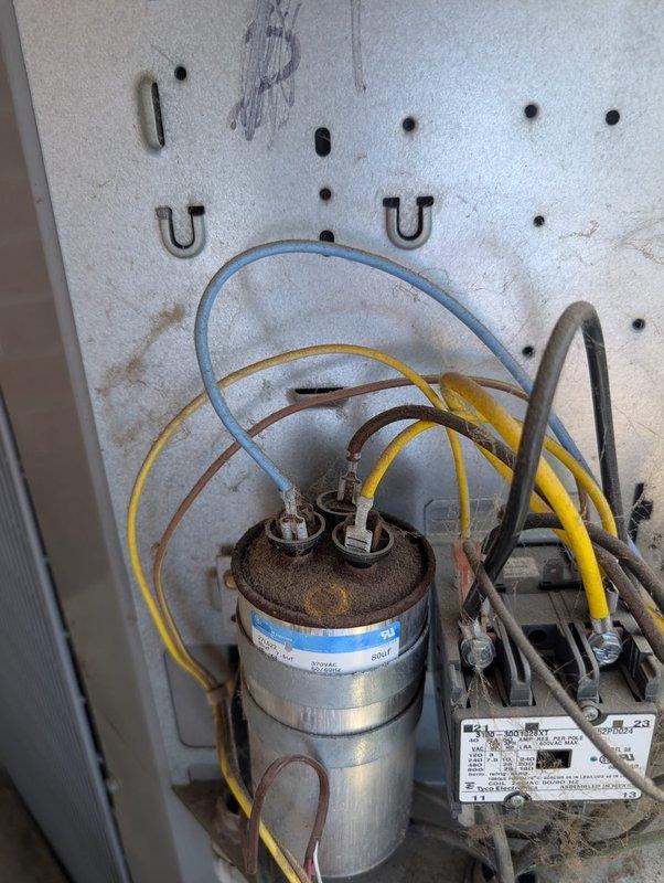 # Commercial A/C Service - No Airflow to Worship Space

Responded to service call reporting no airflow to worship space. Upon inspection, discovered failed capacitor on commercial air conditioning unit serving the affected zone. Capacitor exhibited severe corrosion on terminals and tested outside acceptable range. Replaced defective dual-run capacitor with proper rated replacement. Verified all electrical connections were secure and properly terminated. Tested system operation and confirmed adequate airflow restored to worship space. Unit cooling normally with proper amp draw on compressor and blower motor. System returned to full operational status.
