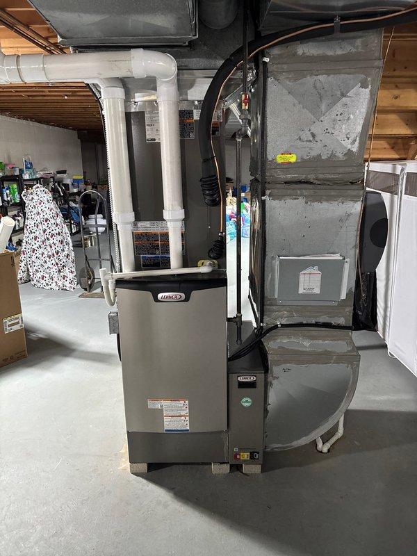 Completed full HVAC system replacement in residential basement, installing new high-efficiency furnace and air conditioning system. Configured all ductwork connections, PVC venting, condensate drainage lines, refrigerant lines, and electrical controls to manufacturer specifications. System tested and verified operational, with all components properly mounted and secured on concrete pad in utility area.