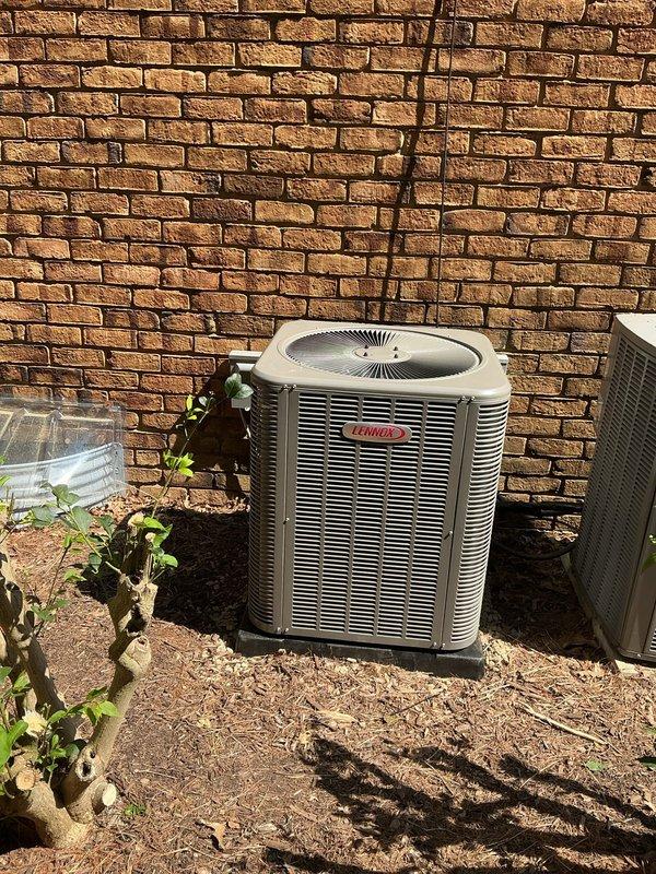 Completed full A/C retrofit installation including new Lennox outdoor condensing unit positioned on concrete pad with proper clearances and a new evaporator coil integrated with existing furnace system. Installed all refrigerant line sets, electrical connections, condensate drain piping with proper trap configuration using white PVC, and reflective metallic supply ductwork with appropriate sealing and insulation to ensure efficient airflow and system performance.