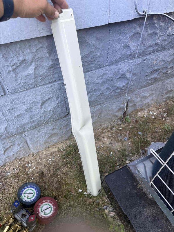 Responded to service call for mini split system displaying low refrigerant error code. Upon arrival, connected manifold gauges to service ports and verified refrigerant charge levels were below manufacturer specifications. Inspected outdoor condenser unit coil and protective grille for damage or blockages, finding fins in acceptable condition. Removed access panel from indoor unit to check for potential leak points and system integrity. System requires refrigerant recharge and leak detection testing to restore proper operation and resolve error code condition.
