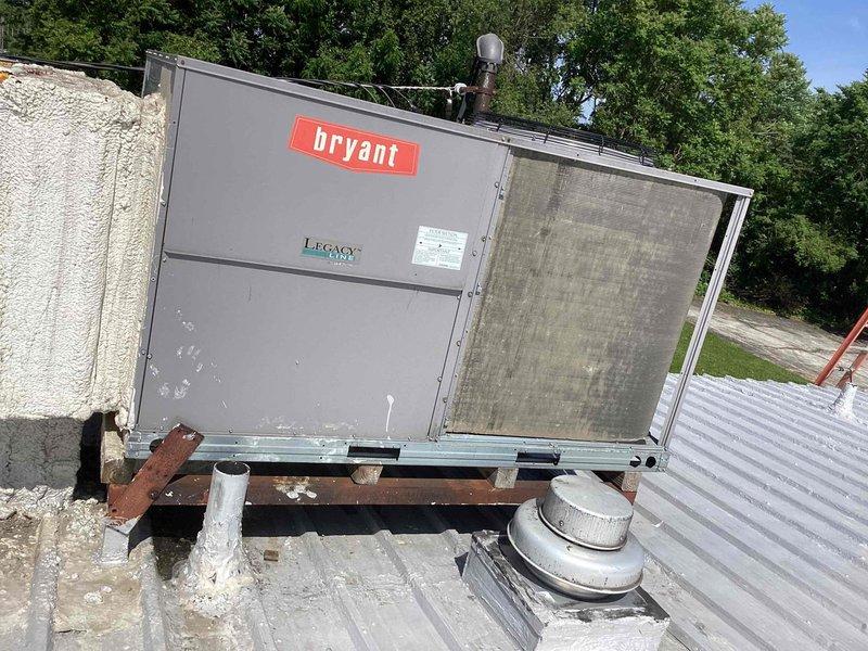 Responded to service call for thermostat error message on Bryant Legacy rooftop package unit. Upon inspection, found heavily soiled air filters restricting airflow and causing system fault. Removed and replaced all four filters with clean units, restoring proper airflow and clearing thermostat service call indicator.