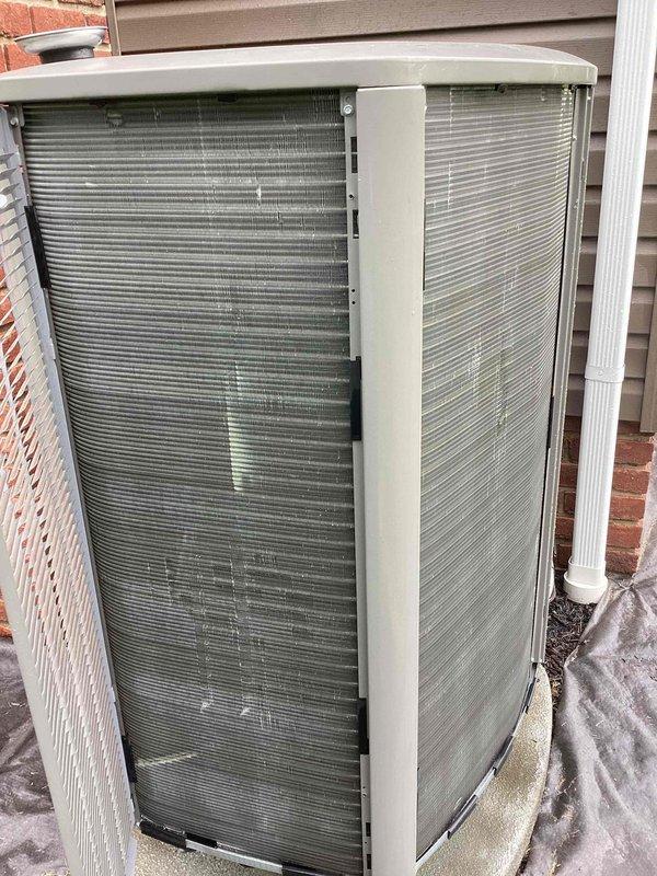 Completed spring maintenance on residential air conditioning system. Performed comprehensive inspection of outdoor condenser unit, verified proper operation of all components, and documented equipment condition. Unit found in good working order with protective grilles and housing intact on concrete pad installation.