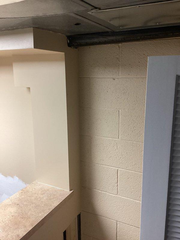 Conducted site assessment for ice maker installation in basement/utility area. Inspected existing plumbing rough-in with copper supply line stubs and PEX shut-off valves protruding from wall. Documented current conditions including exposed framing, unfinished drywall, and accessible water supply connections to determine requirements for completing ice maker hookup.