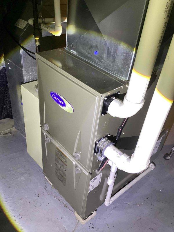 Responded to no-cooling call on 15-year-old Carrier AC system. Upon arrival, found unit completely inoperative. Inspected electrical disconnect and discovered heavily corroded TR25R fuses with significant copper oxidation and turquoise-green patina on metal end caps, indicating prolonged moisture exposure. Corrosion on fuse terminals and copper clips prevented proper electrical contact. Replaced failed fuse assembly with new disconnect fuses rated to manufacturer specifications. Verified proper electrical connections and tested system operation. Unit restored to full cooling capacity with normal amperage draw and proper system function confirmed.