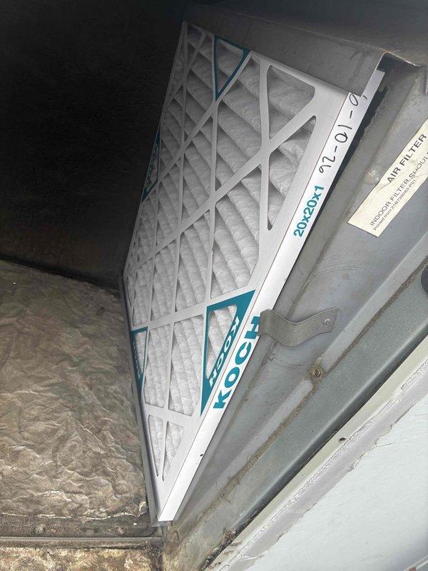 Completed scheduled commercial filter maintenance visit. Removed and replaced heavily soiled HVAC air filters showing significant particulate accumulation and debris buildup across all mesh sections. Installed new KOCH brand pleated filters with proper dimensional specifications in return air vents. Documented pre- and post-service conditions with photographs showing extent of contamination on removed filters and proper installation of replacement units within metal housing and ductwork assembly.