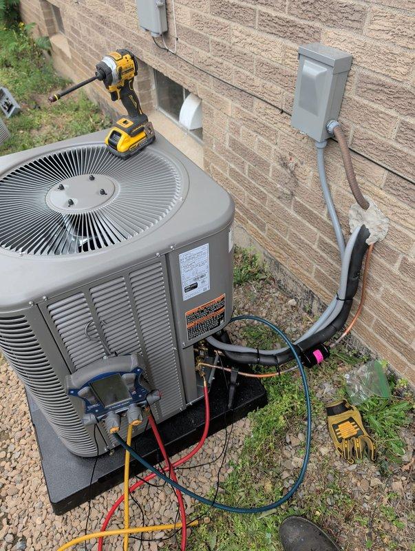 Completed full HVAC system retrofit including furnace and air conditioning unit installation. Installed new outdoor condensing unit on concrete pad with proper electrical disconnect and conduit routing mounted to exterior brick wall. Performed refrigerant line connections and system charging procedures, verified all electrical connections to code, and conducted operational testing to ensure proper system functionality and performance specifications were met.