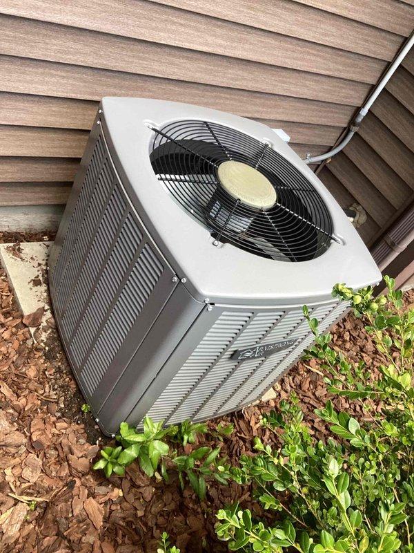 Completed scheduled commercial cooling maintenance visit. Inspected outdoor condenser unit and indoor evaporator coil assembly. Documented current condition of equipment with exterior condenser showing normal operation and indoor coil exhibiting dust accumulation requiring attention during routine maintenance protocol.