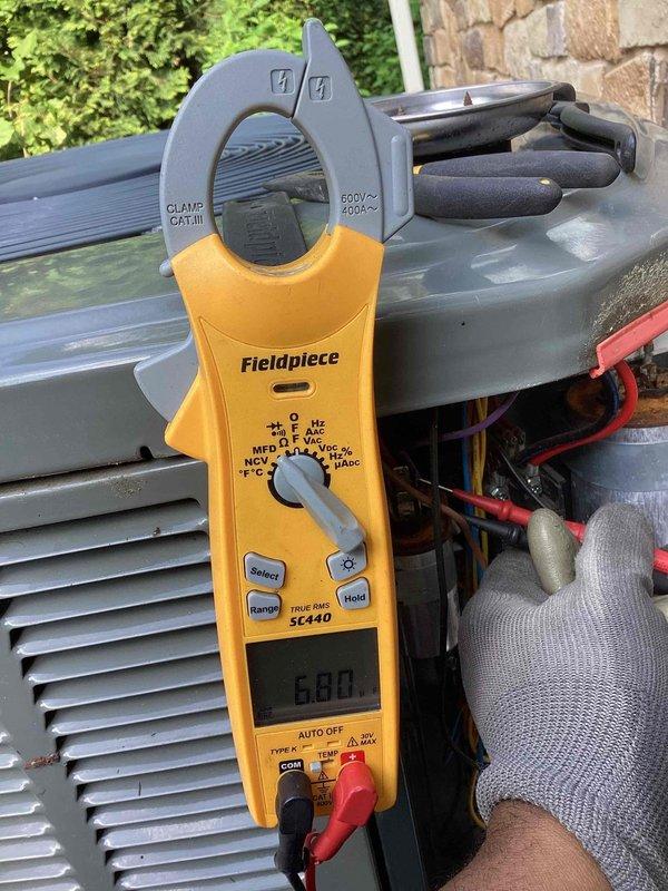 Completed MVP cooling maintenance on two 8-year-old residential air conditioning systems at the property. Performed comprehensive inspection and testing of both AC units, including electrical measurements using clamp meter to verify proper amperage draw and system performance. All components inspected, refrigerant lines checked, and both systems confirmed to be operating within manufacturer specifications.