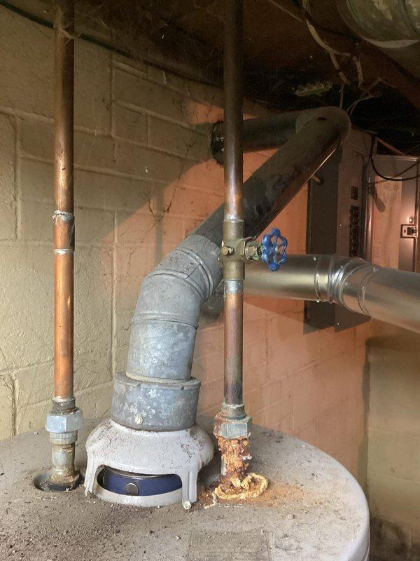 Conducted on-site assessment of existing Maytag tanked water heater system to provide replacement quote. Documented current unit condition through photographic inspection, noting significant corrosion and rust deterioration at pipe connection points near the base of the tank. Evaluated all plumbing connections including copper supply lines, galvanized steel piping with shutoff valve, and vertical discharge piping showing advanced oxidation. Coordinated scheduling with property owner for site access and completed comprehensive visual inspection of mechanical room infrastructure to determine replacement specifications and installation requirements.