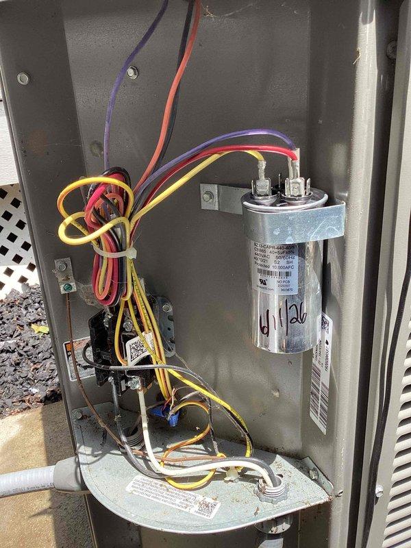 Completed MVP cooling maintenance on two residential air conditioning systems at secondary property location. First unit is 5 years old, second unit is over 8 years old. Performed comprehensive maintenance inspection on both systems including electrical component evaluation, capacitor testing, and temperature readings. Verified proper operation of contactors, relays, and wiring connections. Documented equipment conditions with photos showing electrical panel components and temperature measurements on insulation materials. Both systems operational upon completion of maintenance procedures.