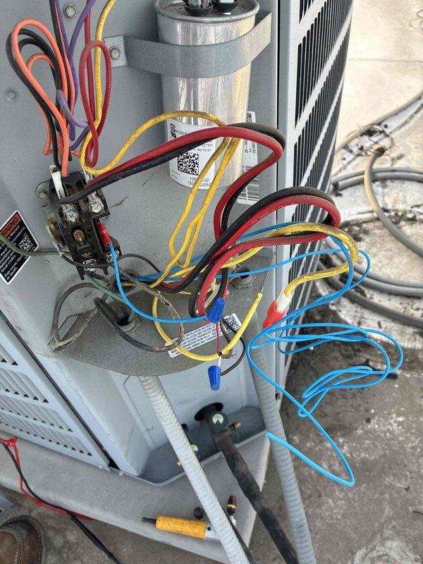Responded to no cooling complaint on residential air conditioning system. Upon arrival, opened condensing unit access panel and performed diagnostic inspection of electrical components. Checked capacitor mounting and wire connections at contactor. Used Fluke T6-600 clamp meter to verify electrical readings, which showed 0.0 amperage draw, indicating compressor was not running. Identified failed contactor as root cause preventing compressor operation. Replaced defective contactor, verified all wire connections secure, and confirmed proper system operation with compressor drawing normal amperage. Unit restored to full cooling capacity.