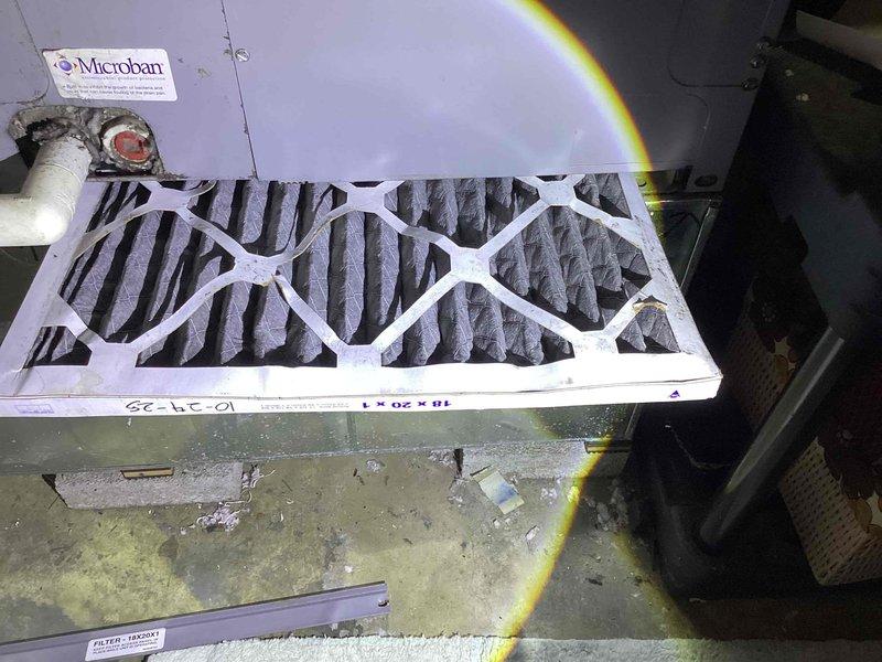 Completed spring maintenance on 13-year-old HVAC system. Inspected air handler and replaced heavily soiled pleated air filter with significant dust accumulation. Verified proper airflow direction markings on ductwork and confirmed system operational status.