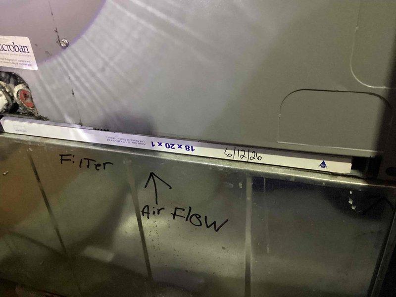 Completed spring maintenance on 13-year-old HVAC system. Inspected air handler and replaced heavily soiled pleated air filter with significant dust accumulation. Verified proper airflow direction markings on ductwork and confirmed system operational status.