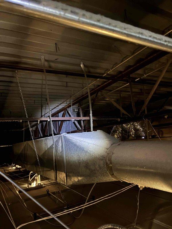 Responded to no cooling complaint on 5-year-old commercial unit. Upon arrival, found evaporator coil heavily frosted due to severely restricted airflow from never having filter changed. Documented frosted suction line and low superheat conditions with diagnostic equipment. Removed and replaced extremely dirty air filter that was completely clogged with debris. Allowed system to defrost, verified proper airflow restoration, and confirmed unit returned to normal cooling operation. Advised customer on importance of regular filter maintenance to prevent future issues.