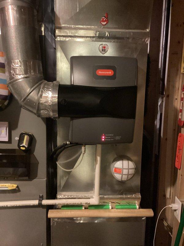 Performed site assessment for automatic water shut-off valve installation. Inspected existing plumbing infrastructure beneath kitchen sink area, documenting current water supply line configuration with pressure regulator and copper piping connections. Evaluated mechanical room layout and main water line access points to determine optimal placement for automated shut-off valve system. Photographed existing plumbing setup including supply lines, pressure regulation equipment, and available installation space. Provided customer with detailed estimate for automatic shut-off valve installation based on current plumbing configuration and accessibility requirements.