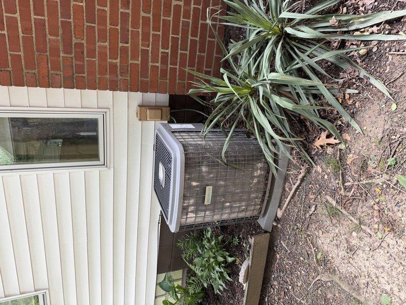 # HVAC Install - Complete System

Successfully completed a full furnace and air conditioning system retrofit at a residential property. The installation included a new furnace/air handler unit positioned in the interior mechanical room with proper condensate drainage routing via white PVC piping, gray flexible and metal ductwork connections, and copper refrigerant line sets. The outdoor condensing unit was installed on a concrete pad against the building exterior with appropriate clearances from landscaping and structures. All refrigerant lines were properly insulated and routed through the building envelope. System was tested, charged to manufacturer specifications, and verified operational. Work area was cleaned and all debris removed upon completion.