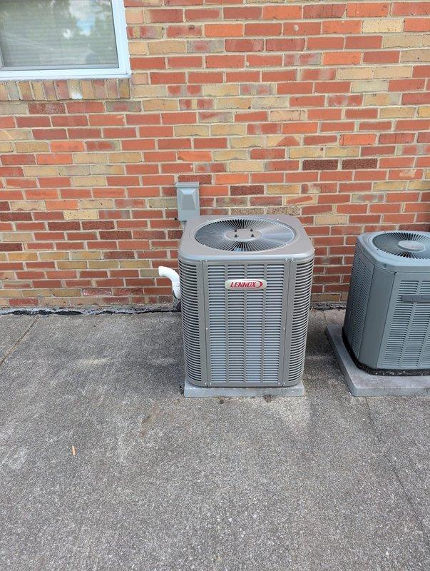 Completed full HVAC system retrofit including installation of new Lennox furnace in basement utility area with proper PVC venting routed through existing infrastructure, and installed dual Lennox outdoor condensing units on concrete pad against exterior brick wall with condensate drainage properly configured. All equipment tested, operational specifications verified, and system commissioned to manufacturer standards.