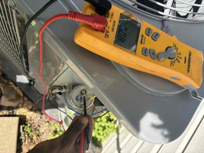 Completed annual maintenance on a 1-year-old residential air conditioning system. Performed electrical diagnostics using testing meter to verify proper voltage and amperage at the condensing unit, inspected condenser coil condition noting minor dust accumulation on fins, and confirmed all electrical connections were secure. Unit operating within normal parameters with no immediate service needs identified.